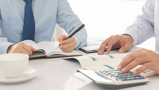 business team analyze financial numbers to view the performance of the company.